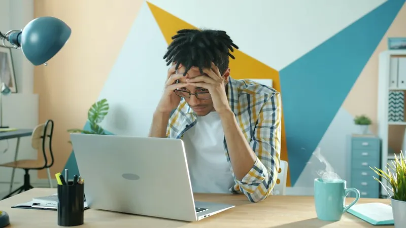 Frustrated founder at a laptop